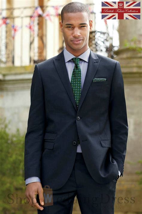 navy blue suit with green tie